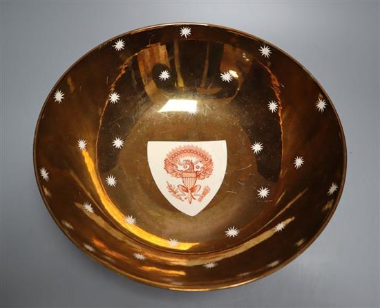 A large Grays pottery copper lustre American armorial bowl, printed with shield crests in iron red, 31cm